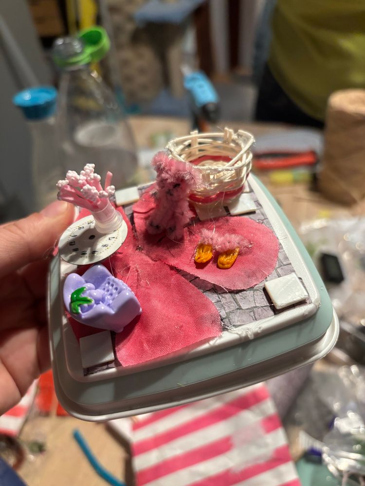 without the lid you can also see the pink and white basket in the back as well as pink slippers on the floor.