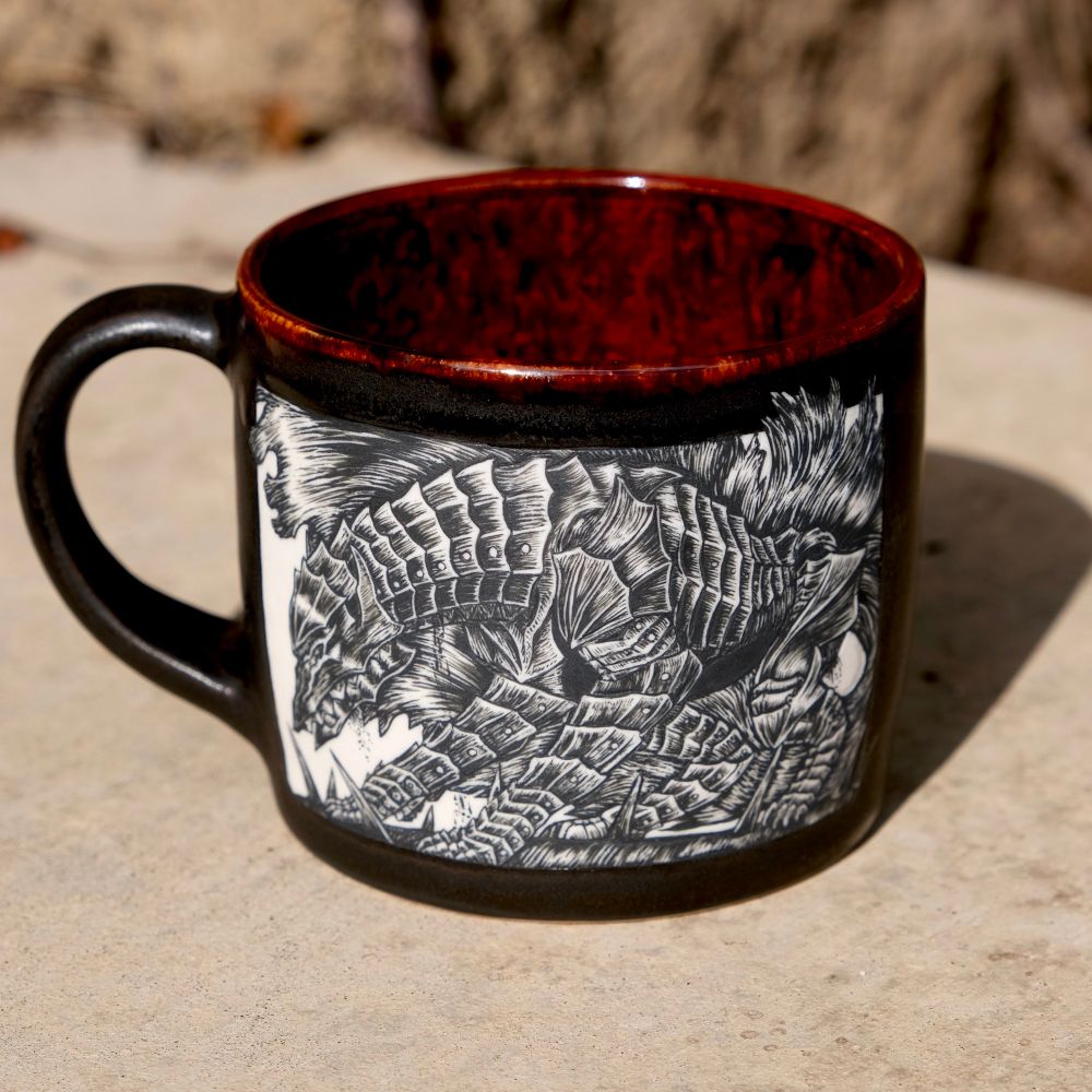Another view of the mug showing the inside glaze. It is a mottled red