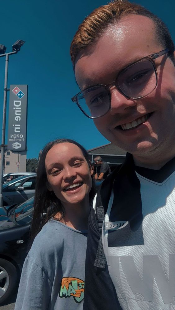 Myself & Demi Laverty, standing together outside on a sunny day.