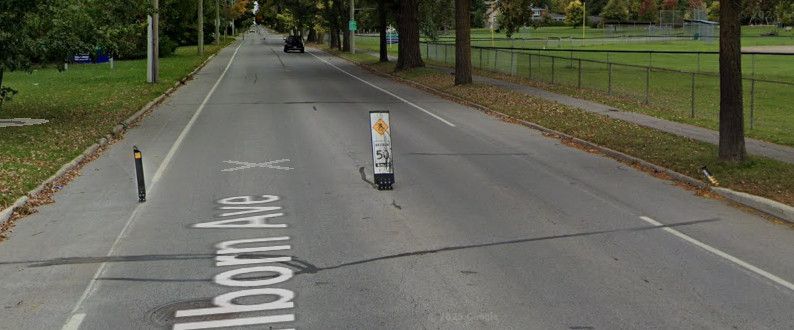three flex posts in various states of having been rammed into by motor vehicles