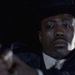 Man crying holding a gun