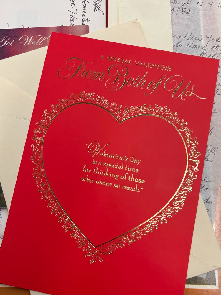 Red card with gold embossing that reads "a special valentine from both of us: valentine's day is a special time for thinking of those who mean so much"