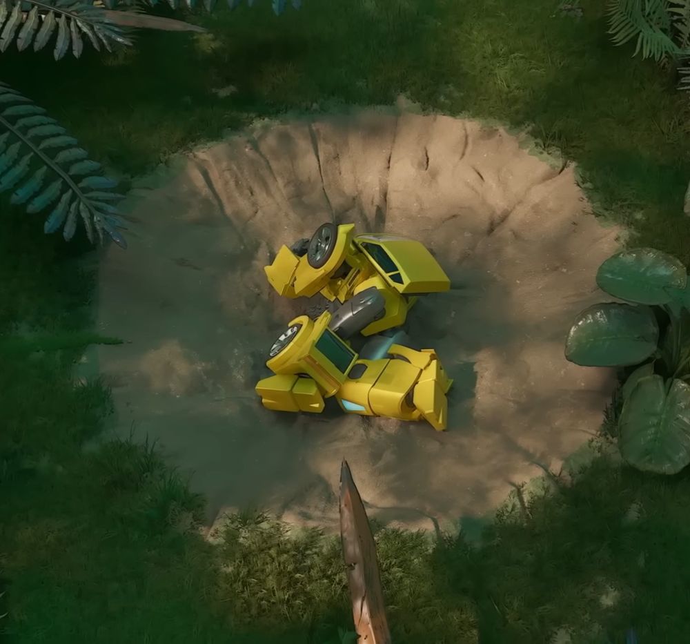 Screenshot from Transformers Cyberworld episode 1 showing Bumblebee lying in a crater in the "Yamcha" pose