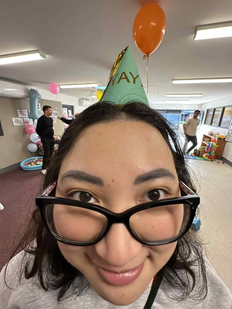 A 0.5 photo of OP wearing a green birthday hat saying YAY. 