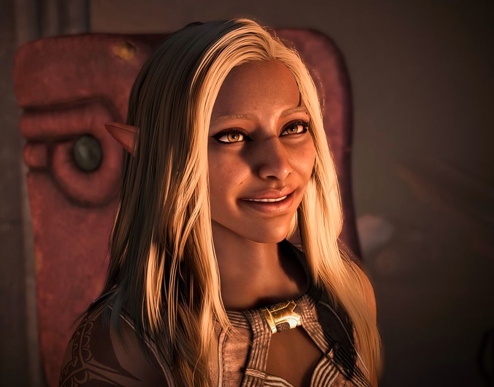 Elven woman with long blonde hair and tan skin. She's smiling softly 