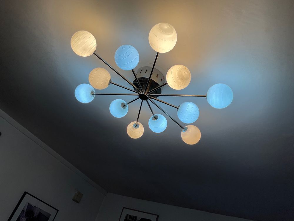 Ceiling light with random blue and yellow light bulbs that looks a bit crap