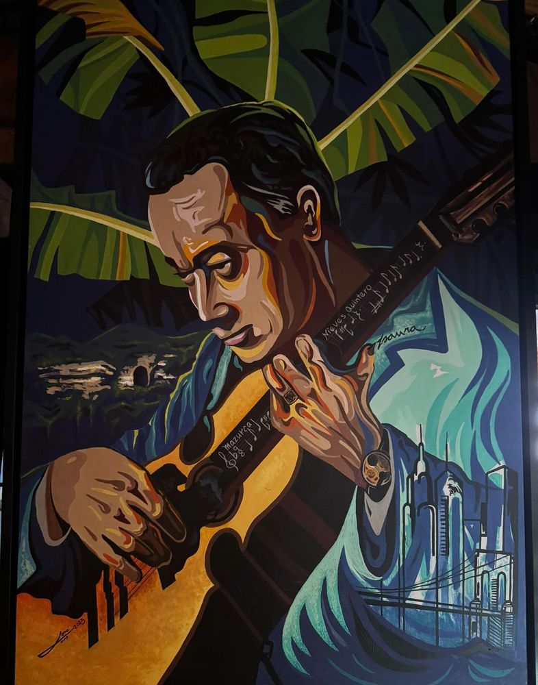 A painting of Puerto Rican Cuatro player Nieves Quintero by Chegui Rodríguez, show with Cuatro in hand, in from of a banana tree, with a silhouette of NYC on his shirt 