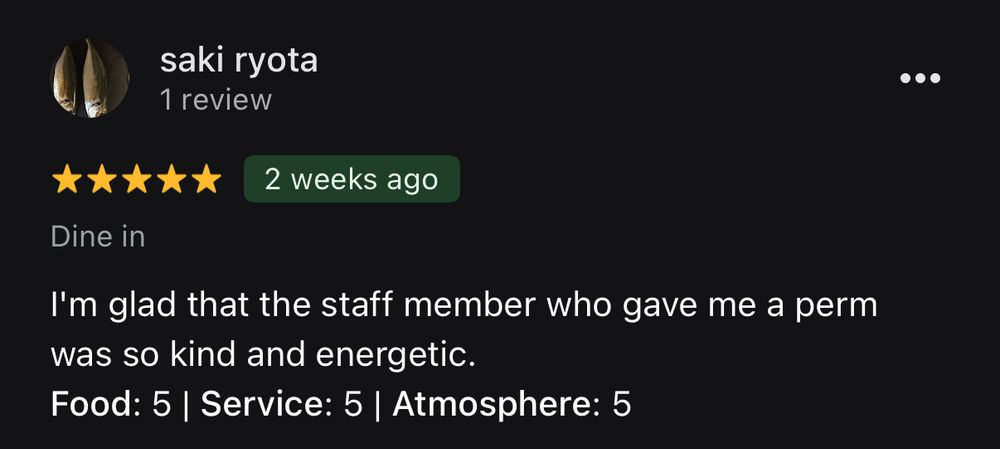 A 5-star translated review from Japanese to English of a ramen restaurant on Google Reviews that reads “I’m glad that the staff member who gave me a perm was so kind and energetic. Food: 5 | Service: 5 | Atmosphere: 5”