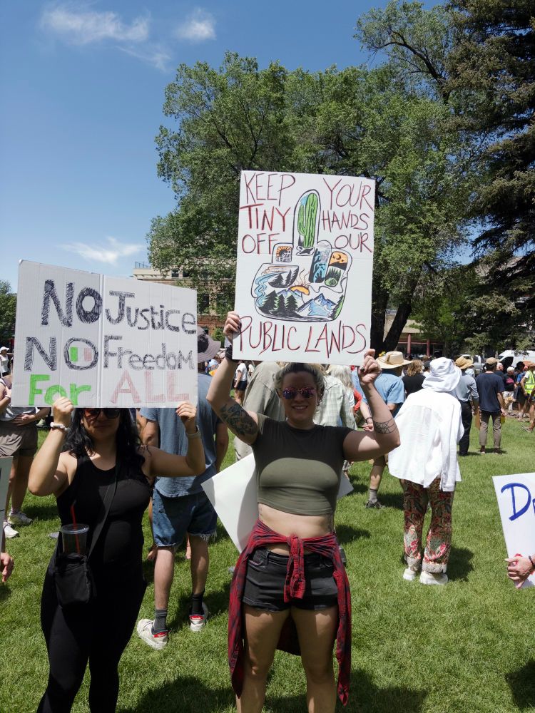 Keep your tiny hands off our public lands protestor with sign