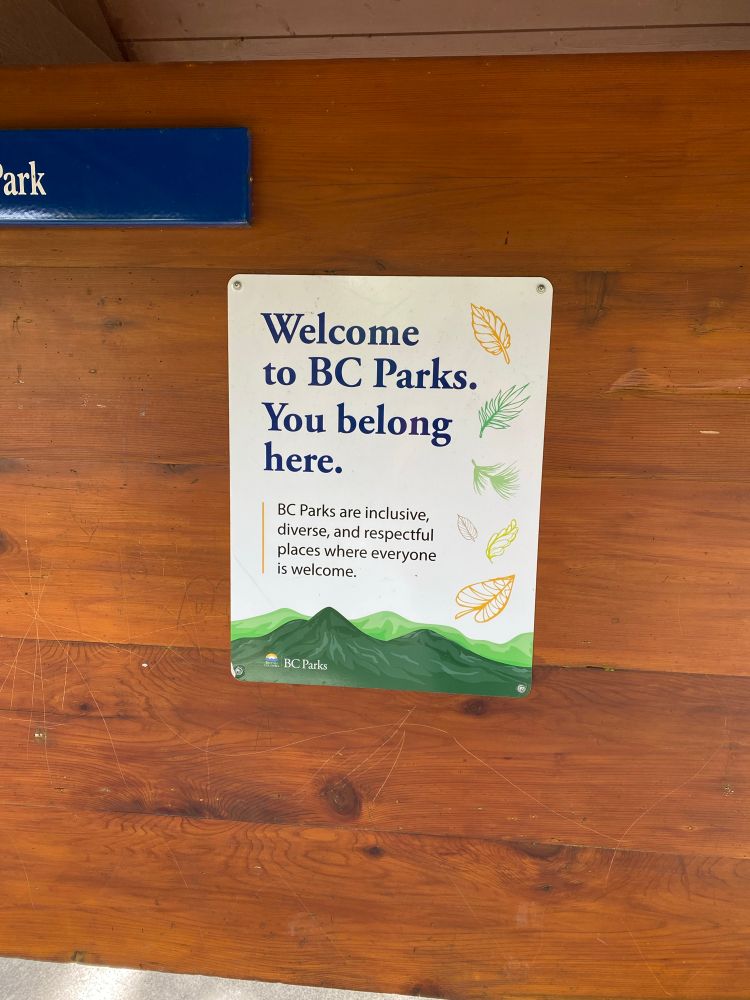 Sign posted at a park. “Welcome to BC Parks. You belong here. BC Parks are inclusive, diverse, and respectful places where everyone is welcome.”