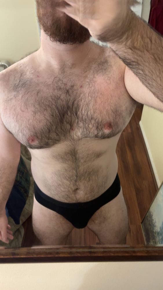 Me in a mirror selfie showing my torso beard down, again in nothing but black briefs 