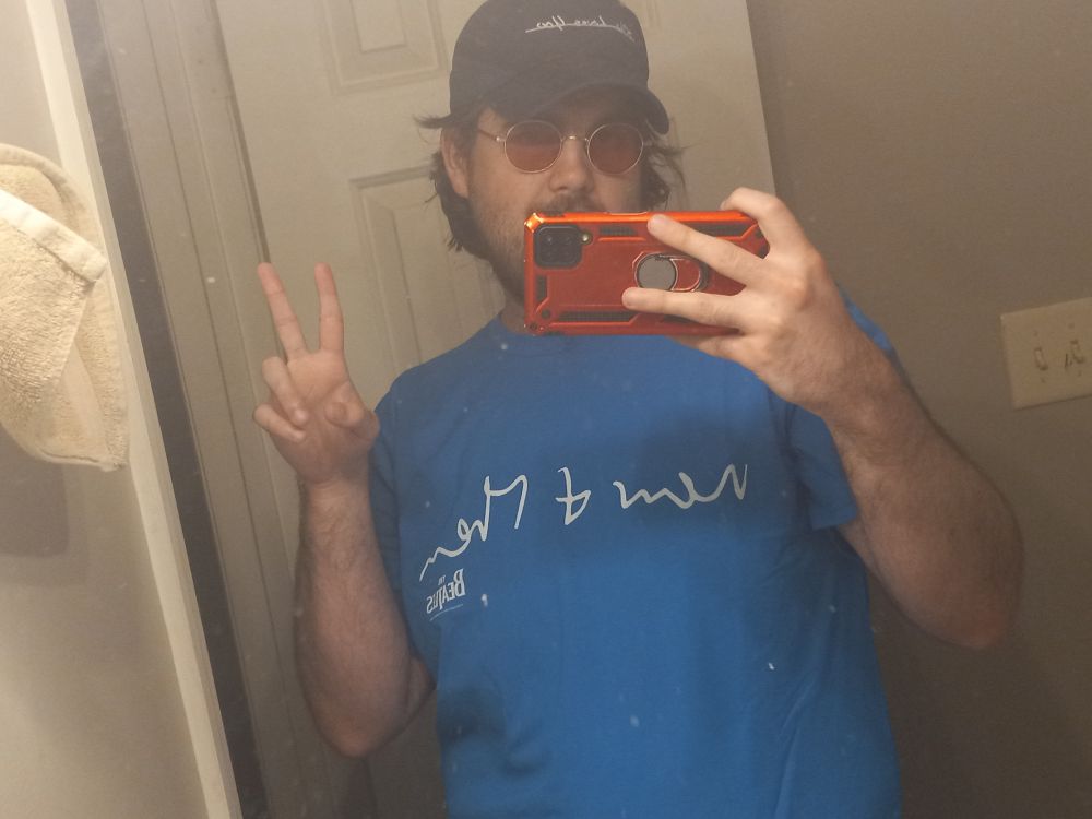 IGNORE DIRTY MIRROR PLS. 

me posing in a mirror wearing a Beatles shirt that says " Now & Then" on the front (and Love Me Do on the back !!),  Beatles X AKILA Sunglasses, and a 'She Loves You' Beatles X Online Ceramics hat!! 