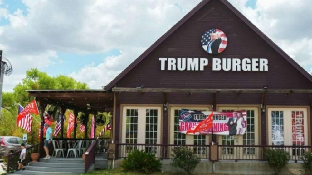 Roland Beainy, co-owner of Trump Burger in Texas, risks losing his green card with his wife. He reportedly owns 50% of the burger chain, with Eddie Hawa