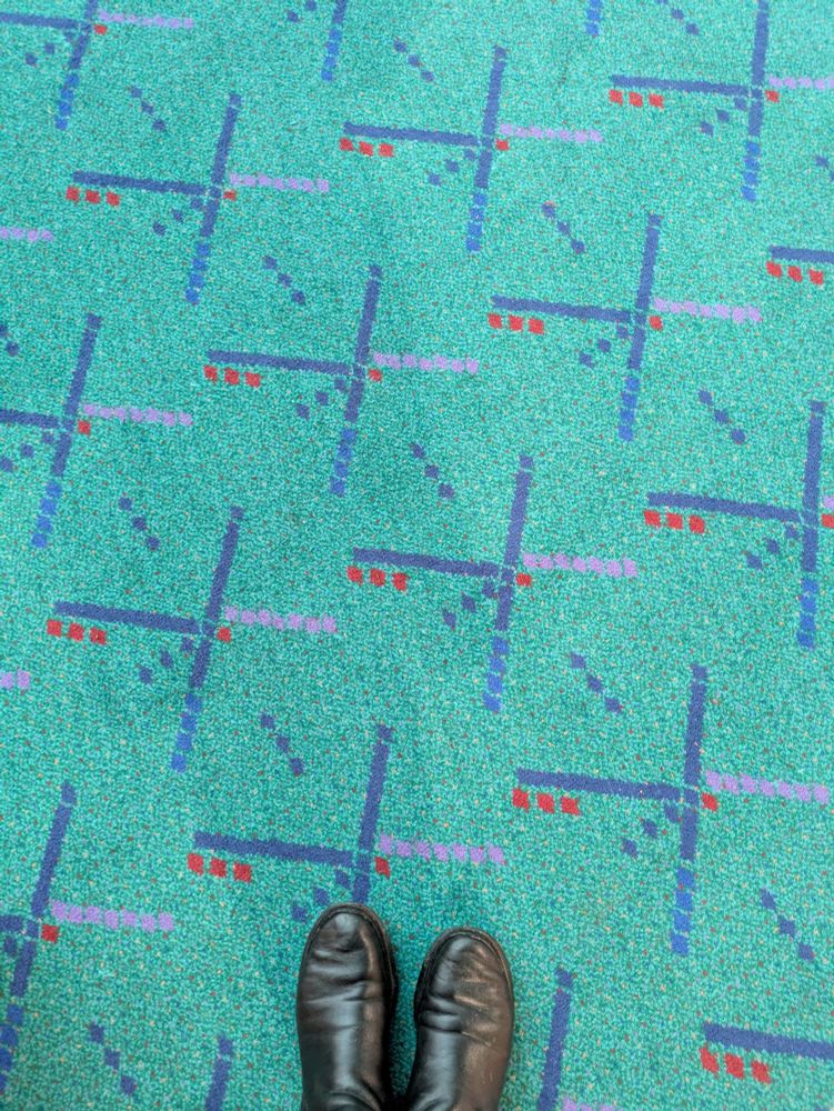 The old PDX carpet with a pair of boots. 