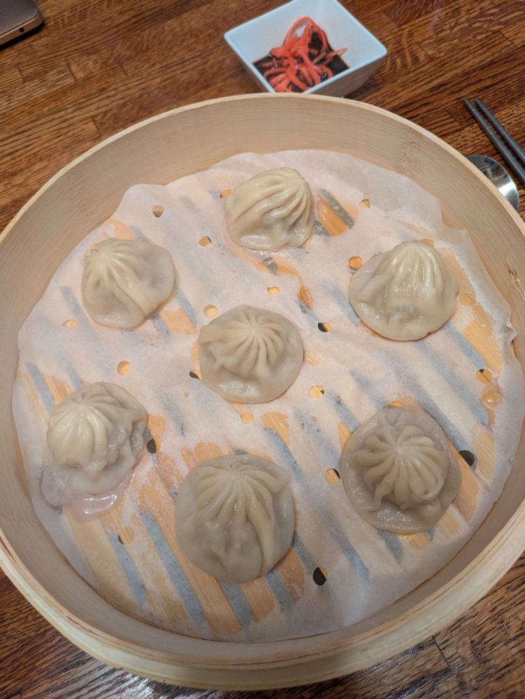 A steamer full of soup dumplings. 