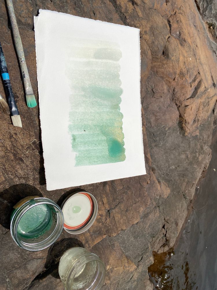 natural watercolour paint processes (turquoise shimmer) at a boreal shield shoreline