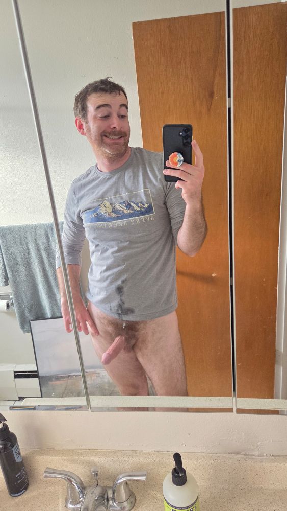 Mirror pic in a shirt no pants, dick still hard, shirt covered in cum