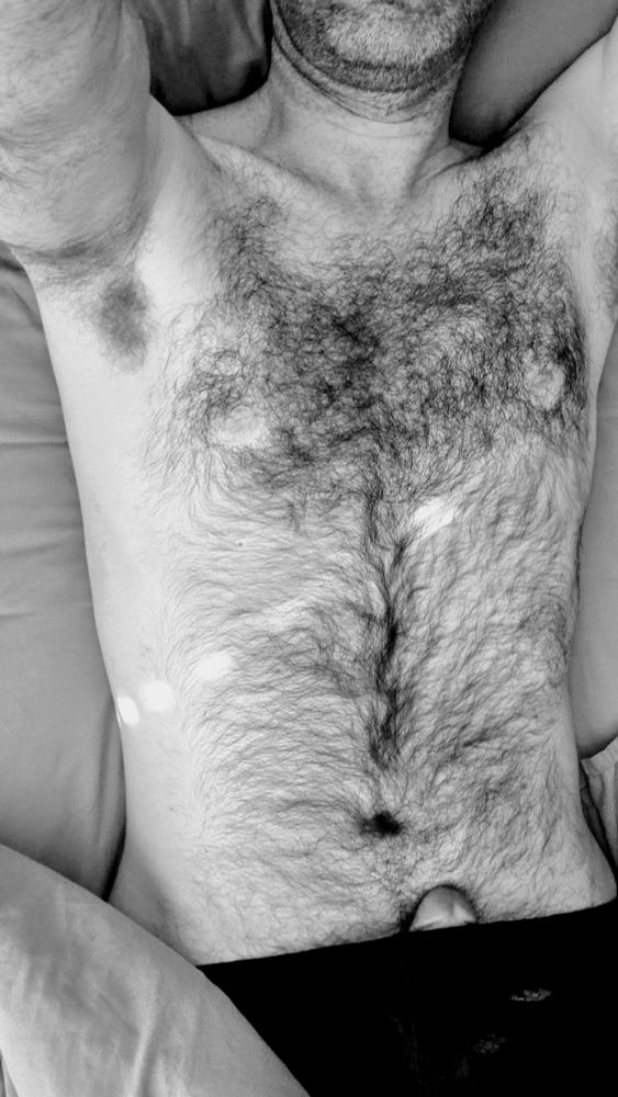 Shot from about, shirtless, with the tip peaking out of my shorts. In black and white