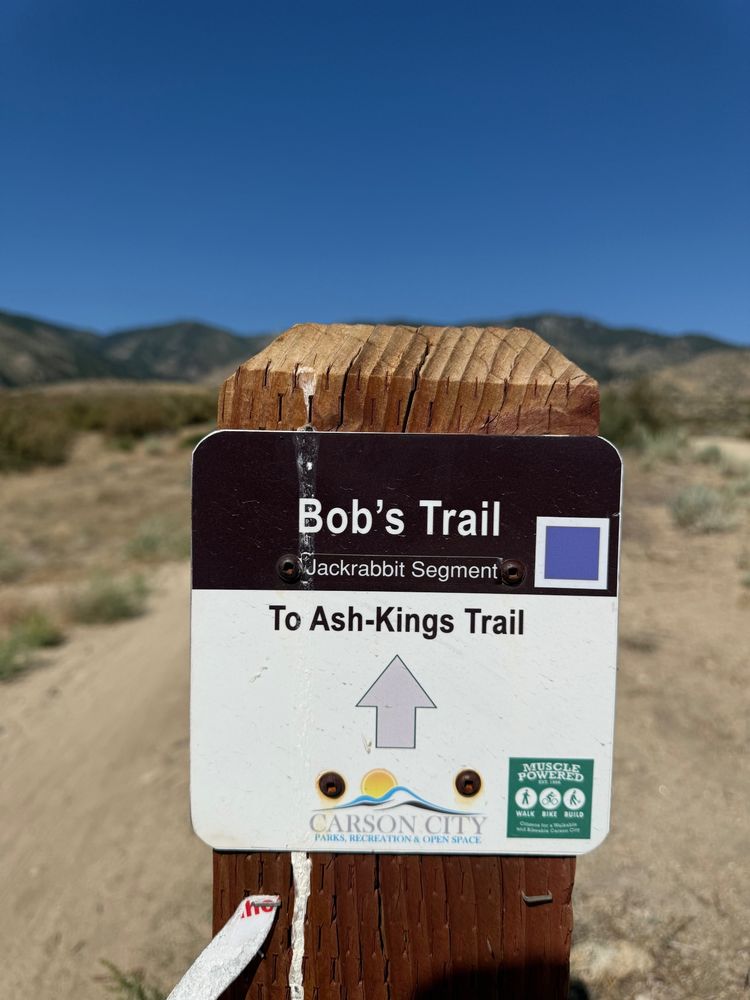 Signpost for the Jackrabbit Segment of Bob's Trail heading to the Ash to Kings Trail. Carson City logo at the center bottom of the sign, and Muscle Powered logo (green square) at bottom right

All the trails in this area are clearly signed, well maintained, and easy for visitors like me to follow