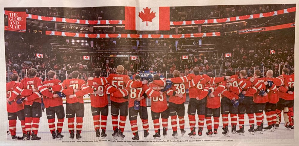 The Canadian men’s hockey team, celebrating the subjugation of the proposed Southern territory in the Four Nations Face-Off. The team is arranged left-to-right across the photo. Shot taken from the rear.