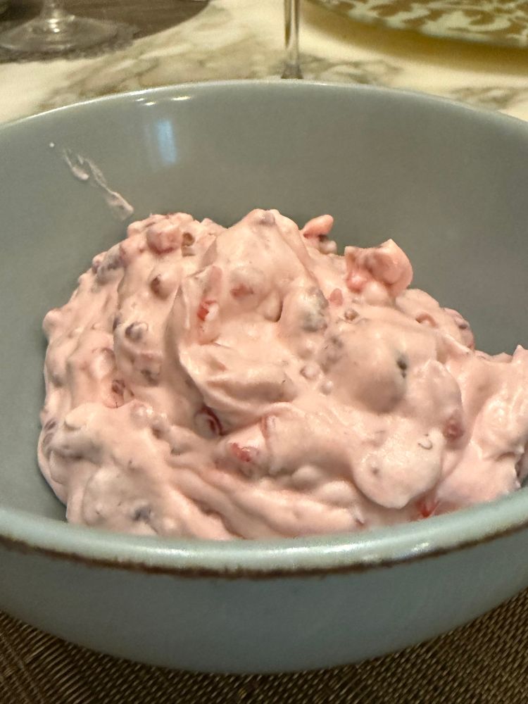Redcurrant and raspberry fool in a blue bowl