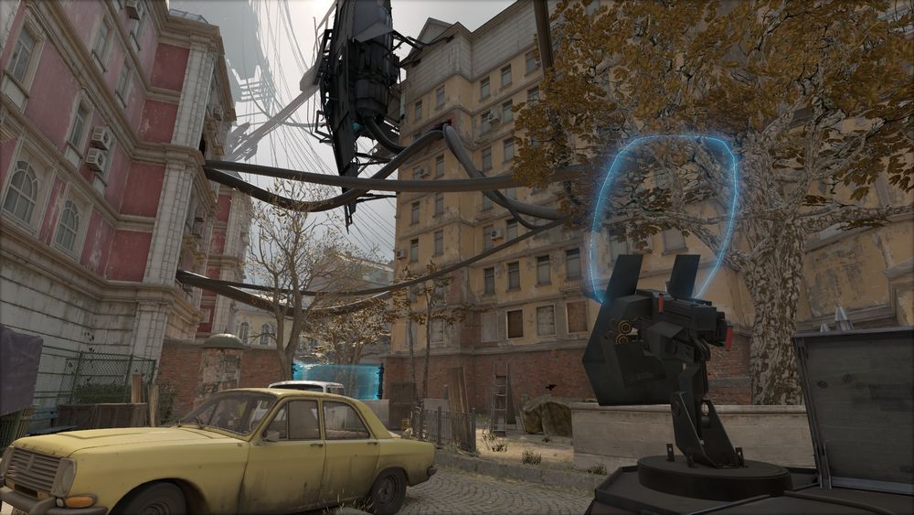 A Half-Life: Alyx screenshot showcasing a courtyard and a large gun.