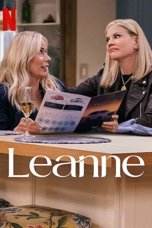 The poster for tv series Leanne. With two blond women looking at each other. One is holding a magazine. There is a glass of white wine on the table.  
