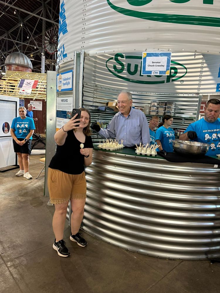 Senator Chuck Grassley serving eggs to fairgoers at the Iowa egg council booth