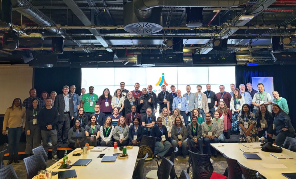 A group of several Google Champions stood together for a photo at Google Offices in London.