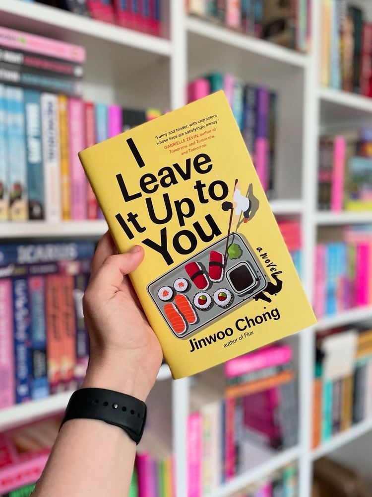 Book cover for I Leave It Ip To You by Jinwoo Chong

Blurb:

A coma can change a man, but the world Jack Jr. awakens to is one he barely recognizes. His advertising job is history, his Manhattan apartment is gone, and the love of his life has left him behind. He’s been asleep for two years; with no one to turn to, he realizes it’s been ten years since he last saw his family. 

Lost and disoriented, he makes a reluctant homecoming back to the bustling Korean American enclave of Fort Lee, New Jersey; back into the waiting arms of his parents, who are operating under the illusion he never left; and back to Joja, their ever-struggling sushi restaurant that he was set to inherit before he ran away from it all. As he steps back into the life he abandoned - learning his Appa’s life lessons over crates of tuna on bleary-eyed 4 AM fish runs, doling out amberjack behind the omakase counter while his Umma tallies the night's pitiful number of customers, and sparring with his recovering alcoholic brother, James - he embraces new roles, That of romantic interest to the male nurse who took care of him throughout, and that of sage (but underqualified) uncle to his gangly teenage nephew.