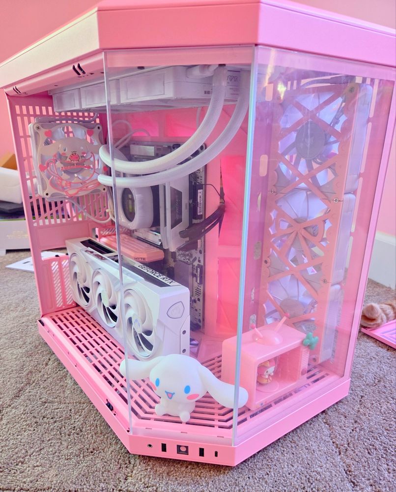 A pink and white themed computer 
