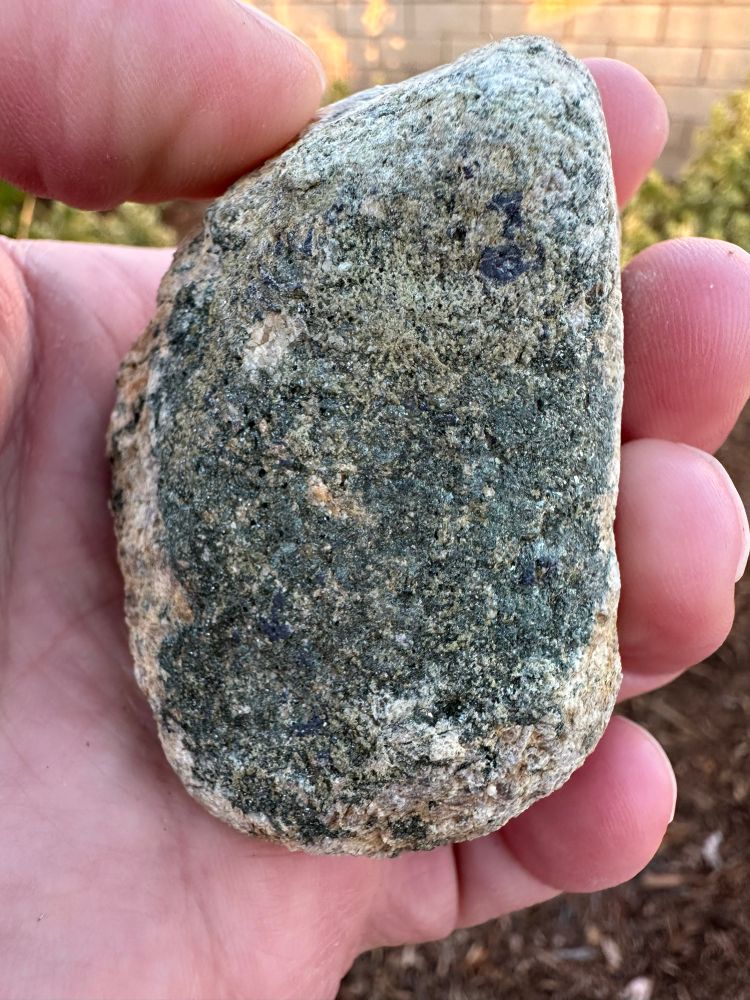 A rock with a green side