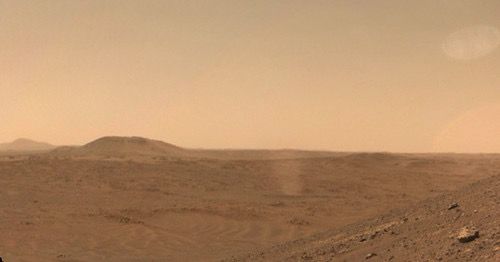 A large but faint dust devil vortex in the distance.

NASA/JPL-Caltech/Kevin M. Gill