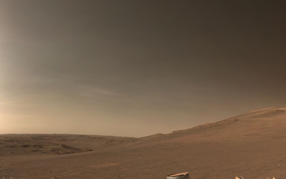 A barren landscape and butterscotch sky. Thin clouds are faintly visible.

NASA/JPL-Caltech/Kevin M. Gill