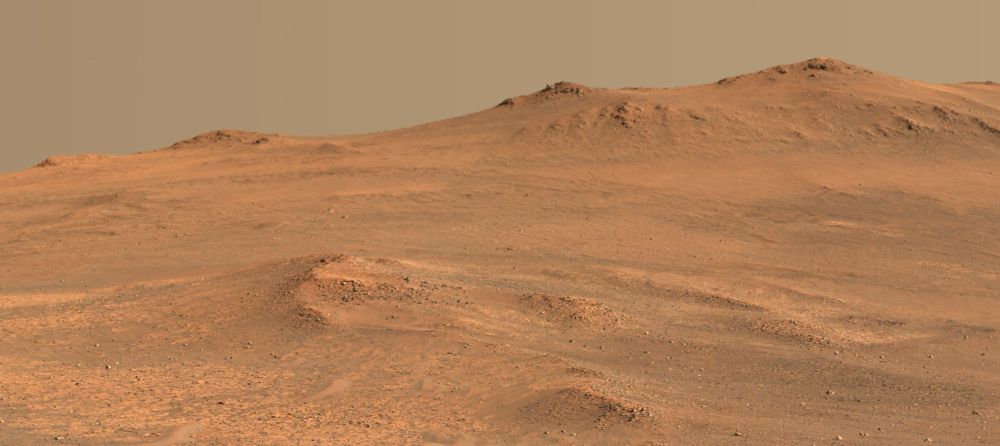 A pair of peaks over a rising martian landscape. A Waffle House just out of frame to the right shows that the view is facing southeast.

NASA/JPL-Caltech/ASU/Kevin M. Gill