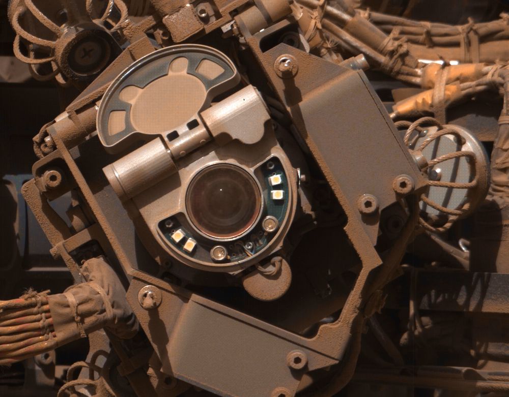 A camera lens surrounded by all sorts of technology. All is covered in a layer of martian dust.

NASA/JPL-Caltech/MSSS/Kevin M. Gill
