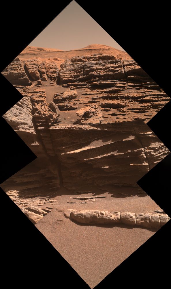 A stratified rock ledge over sand.

NASA/JPL-Caltech/MSSS/Kevin M. Gill