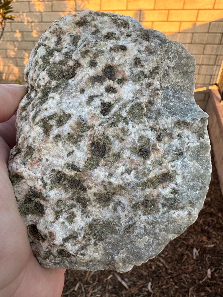 A rock with green minerals