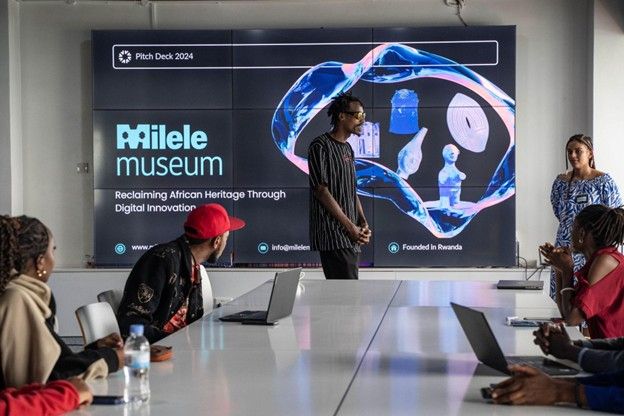 Bruce "Canda" Niyonkuru presenting a pitch on reclaiming African heritage through digital innovation.