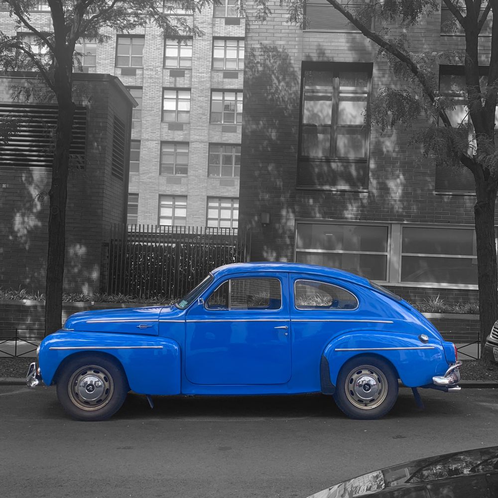 A blue Vintage Volvo automobile on the streets of Brooklyn