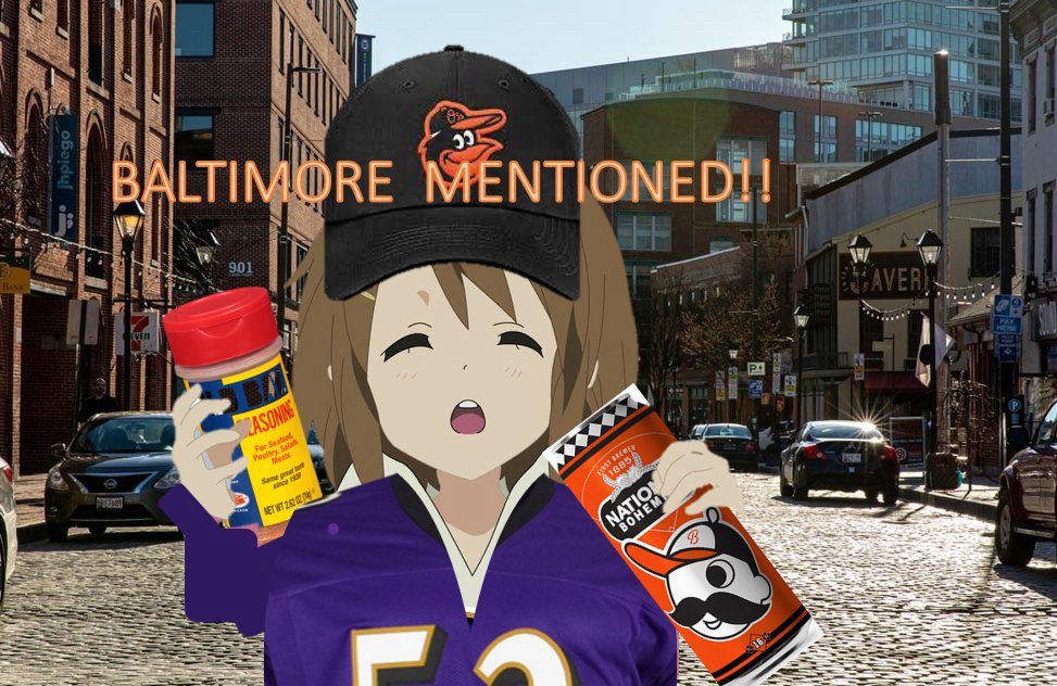 Anime character wearing a Baltimore Ravens jersey and hat, holding Old Bay seasoning and Utz crab chips, stands on a cobblestone street with "Baltimore Mentioned!!" text overhead.