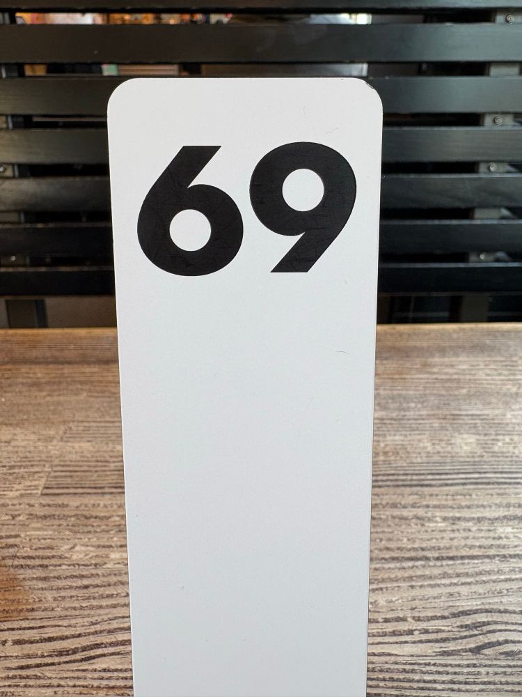 A picture of a number plaque at a fast food place. The number is “sixty nine” 😘