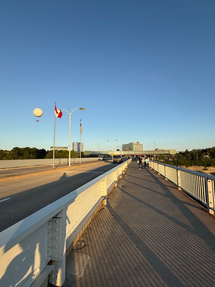 A mournful photo on the Rainbow Bridge in Niagara Falls, looking back at America from across the US-Canadian midpoint of the Niagara River.