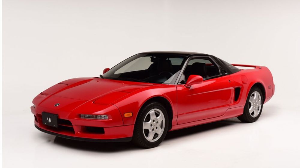 A red 1991 Acura/Honda N S X against a solid white background 