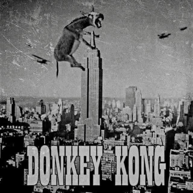 Donkey on the Empire State Building with bi-planes flying around it and the words DONKEY KONG