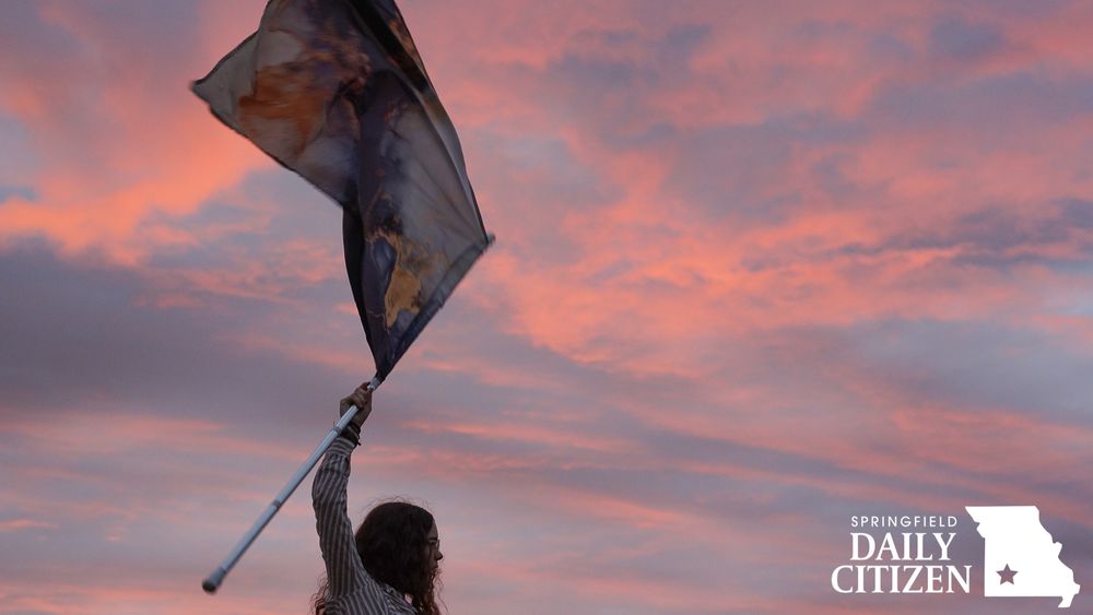 Central High School junior Lael Kennedy twirls her flag during an early morning practice on Thursday, Aug. 28, 2025, in Springfield. (Photo by Ellie Frysztak)