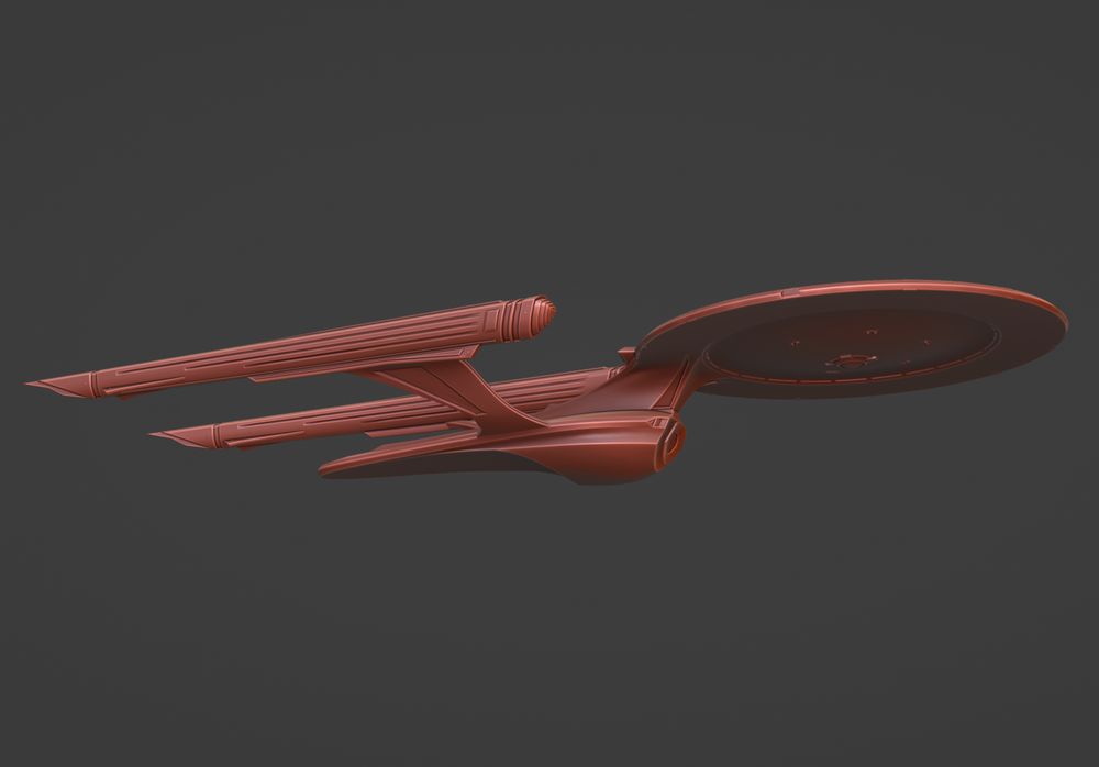 red clay model of a variation of the Enterprise from Star Trek