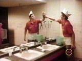 From Fast Times at Ridgemont High. Young man in fast food worker uniform wipes graffiti from restroom mirror 