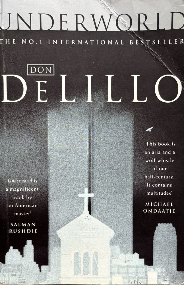 illustration of church and buildings in a schematic style in grey and faded black. 