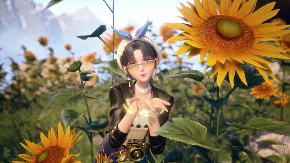 In game screenshot of Nikki in Infinity Nikki posing around sunflowers. She has a black leather jacket, yellow top, blue skirt with sunflowers, and a blue and white hat. 